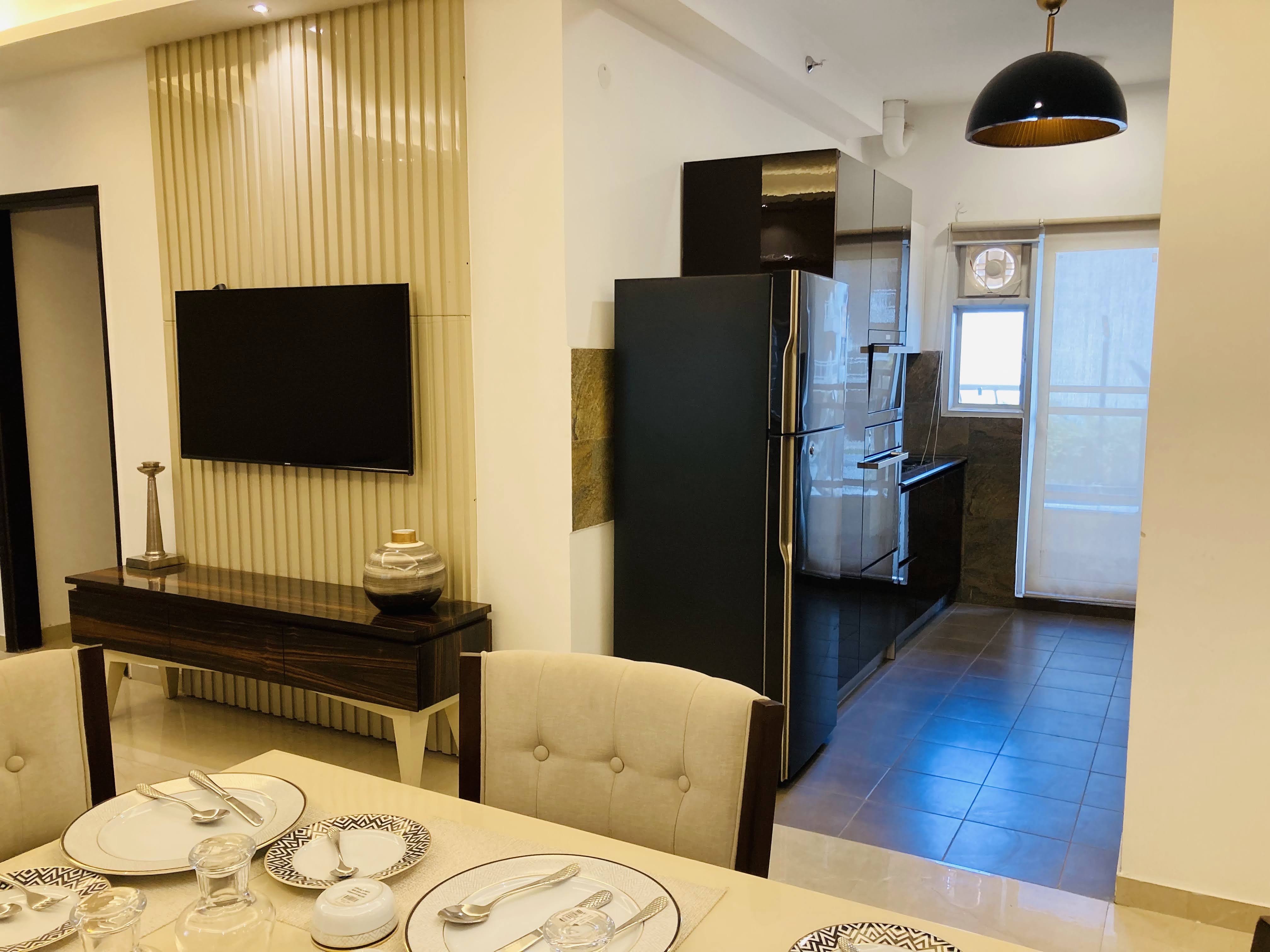 Elite Golf Green — Modern open kitchen and dining space